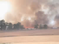 4:03pm Fire threatening Brooks house.